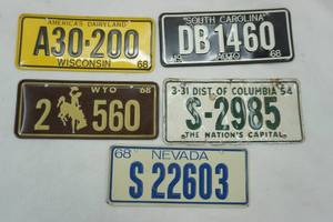 lot 242 image: 4 mini license plates 5x 2