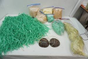 lot 411 image: Several Hula Skirts & Coconut top