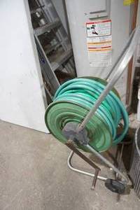 lot 418 image: Vintage Hose Reel with hose