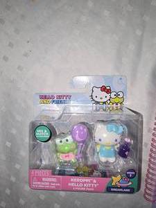lot 28 image: hello kitty figure and journal