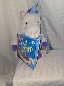 lot 117 image: unicorn stuffy and book