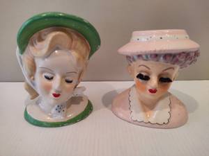 lot 43 image: Two Lady Head Vases