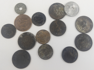 lot 257 image: 1 bag of misc. world coins worn, burnt, bent, drilled, etc. most from the 1800s