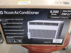 lot 31 image: LG 6,000 BTU 115-Volt Window Air Conditioner Cools 250 sq. ft with Remote and Dehumidifier in White
