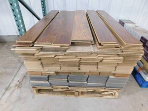 lot 25 image: Pallet lot of Assorted Click Plank Laminate Water Resistant Flooring - Mix of colors , Styles.