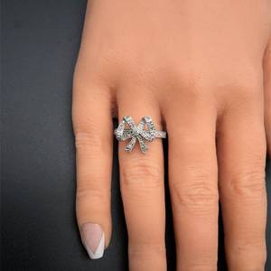 lot 35B image: Elegant PavDiamond Ring with a Dramatic Ribbon Bow Style in 14k White Gold VIDEO