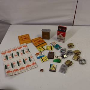 lot 33 image: SMOKERS DELIGHT LOT - Match collection (even the test printout match book sheet) Marlboro tin, a ton of old school wick lighters.