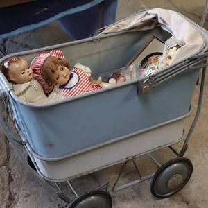 lot 121 image: Tray-L-Eez vintage baby buggy metal childs buggystroller full of vintage dolls. Sleepy eye dolls