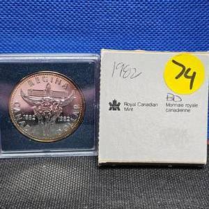lot 74 image: 1982 Canada Centennial Dollar (ReginaCowskull) Light ToningRim