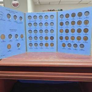 lot 118 image: (25) Indian Head Cents with Book