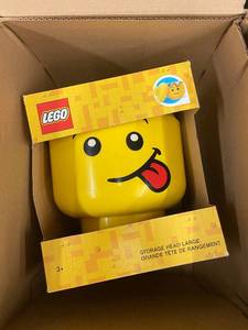 lot 124 image: LEGO Large Storage Head with Tongue Out Design