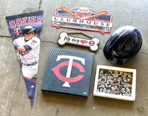 lot 180 image: Minnesota Twins Baseball Wall Decor, Pennant, Helmet and More