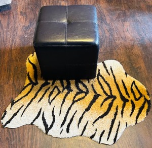 lot 238 image: Petite Leather Look Footstool and Small Faux Tiger Rug