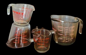 lot 93 image: Glass Measuring Cups by Pyrex and Anchor