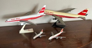 lot 315 image: Four Vintage TWA Airplane Figurines