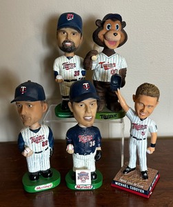 lot 325 image: Minnesota Twins Baseball Bobble Head Figurines including Cuddyer, Radke, Aguilera, Nathan and TC