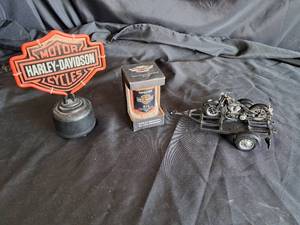 lot 69 image: Harley Davidson lot (Sign - No cord, Oil Can ornament, Tour & Show Trailer)