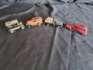 lot 70 image: Harley Davidson set of 4 coin Bank cars