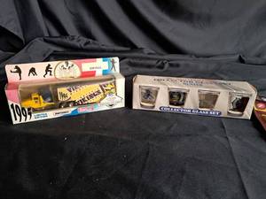 lot 140 image: Vikings 1995 Semi NIB, VIkings Shot Glass Collection NIB, Randy Moss Statue NIB