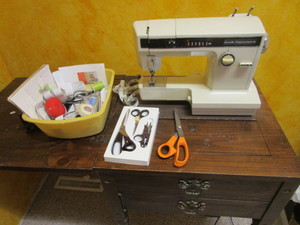 lot 35 image: Kenmore Cabinet Sewing Machine & Notions