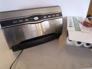 lot 64 image: Food Saver & Rolls