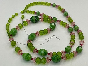 lot 8 image: Faceted Green and White Swirl Bead with Pink and Green Glass Bead Strand