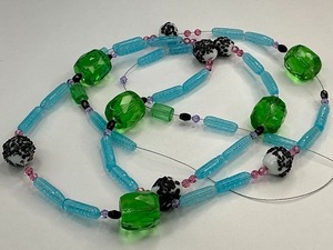 lot 11 image: Green Crystal Faceted Glass Beads with Black Dot Milk Glass and Czech Blue Tube Bead Strand
