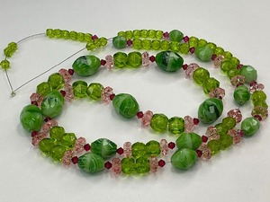 lot 30 image: Faceted Green and White Swirl Bead with Pink and Green Glass Bead Strand