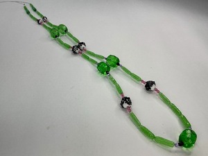 lot 48 image: Faceted Green Glass Bead with Green Tube Bead and Black Dot Milk Glass Bead Strand
