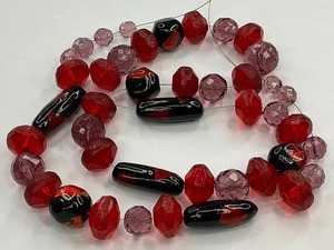 lot 66 image: Red Glass Bead Strand with Red Foil Black Beads