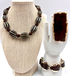 lot 28 image: Wood and Metal Bead Necklace, Bracelet and Lipstick Compact with Mirror - England