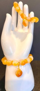 lot 35 image: Set of 2 Orange and Yellow Jade Bead Bracelets with Pot Charms