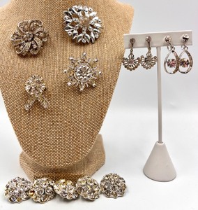 lot 69 image: Vintage Rhinestone Brooches, Buttons and Earrings Set Featuring a Sterling Silver Trifari Brooch