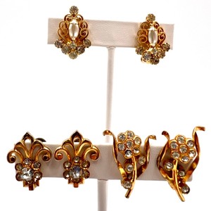 lot 73 image: Set of 3 Pairs of Vintage Gold Clip-On Earrings with Rhinestone Accents Featuring Hope Chest Earrings