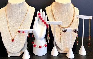 lot 103 image: Elegant Jewelry Collection with Necklaces and Earrings Including 14K gold Stamped Earrings, Trifari and Park Lane Pieces