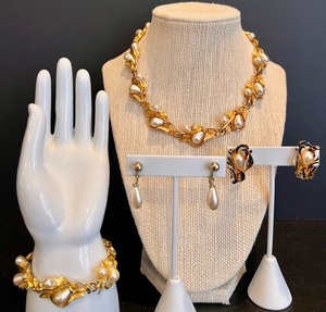 lot 123 image: Elegant Gold Toned and Faux Pearl Jewelry Set with Necklace, Bracelet, and 2 Pairs of Earrings by Hope Chest and Sac
