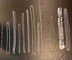 lot 168 image: Collection of 12 Necklaces and 2 Bracelets in Various Silver Toned Chain Styles & one Marked 14K GP