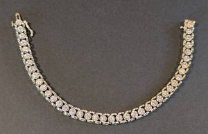 lot 26 image: 14k Yellow Gold and Diamond Tennis Bracelet