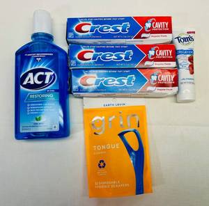 lot 68 image: Crest Toothpast, Toms Toothpast, Act Floride Mouthwash & Grin Tongue Cleaners