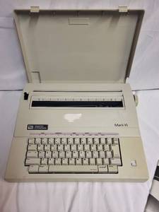lot 218 image: Smith Corona Mark VI Electric Typewriter with Operation Manual
