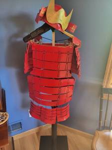 lot 66 image: Traditional Red Samurai Costume with Helmet and Display Stand