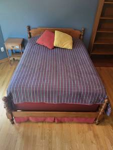 lot 70 image: Solid Wood Full-Size Bed Frame with Bedding and Pillows