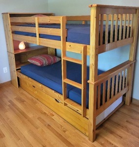 lot 73 image: Twin over Twin Solid Mission Bookcase Wood Bunk Bed with Trundle and Navy Bedding