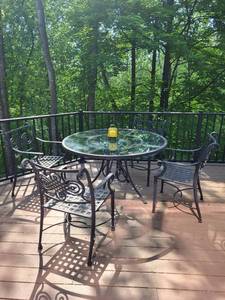 lot 99 image: Outdoor Patio Set with Glass Top Table and 4 Ornate Metal Chairs