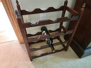 lot 32 image: Vintage Wooden Wine Rack with Decorative Finials