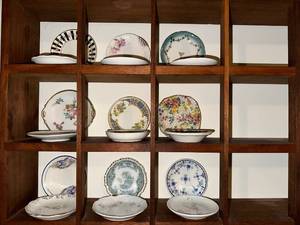 lot 112 image: Set of 9 Vintage Decorative Porcelain Butter PatPadChip Plates and Display Shelf