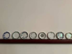 lot 113 image: Set of 8 Antique Decorative Porcelain Butter Pat Pad Chip Plates with Floral Designs and Shelf