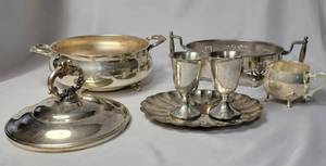 lot 21 image: English Silver Casserole with cover. The other dishes are pewter.