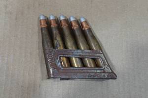 lot 199 image: Steyr M95 8mm Mauser Clip with 5 Silver Tip Rounds