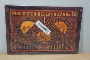 lot 49 image: Novelty Metal Sign - Winchester Repeating Arms Co